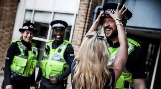 police wearing body cameras smiling